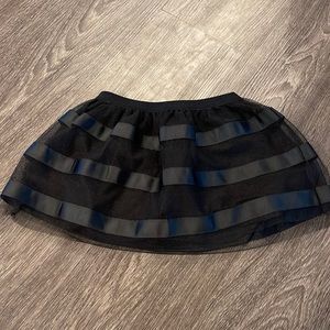 Black mesh skirt with solid black slip. NWT